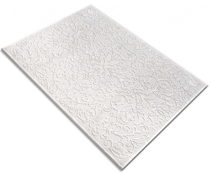 Covor alb modern asezat in decor de living, creeaza un ambient cald si confortabil