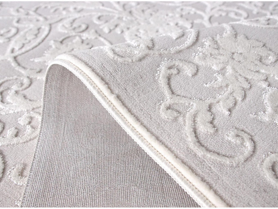 Detaliu finisaj covor alb cu margini rezistente, realizat pentru utilizare zilnica