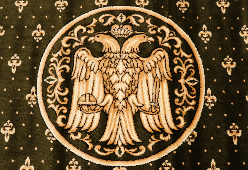 Detaliu vultur bicefal pe covor bisericesc oval verde, simbol traditional ortodox