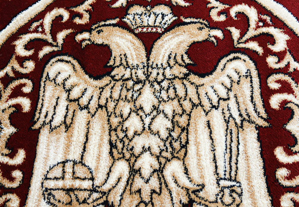Detaliu vultur bicefal pe covor bisericesc rotund grena, simbol traditional ortodox