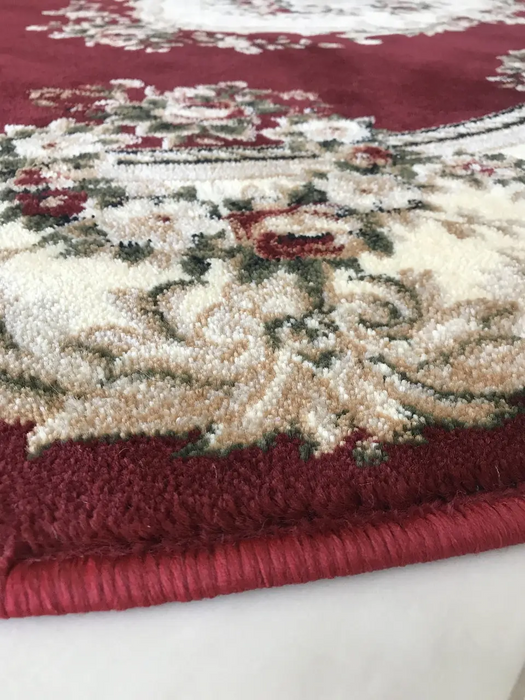 Detaliu covor clasic floral oval grena cu motive florale traditionale