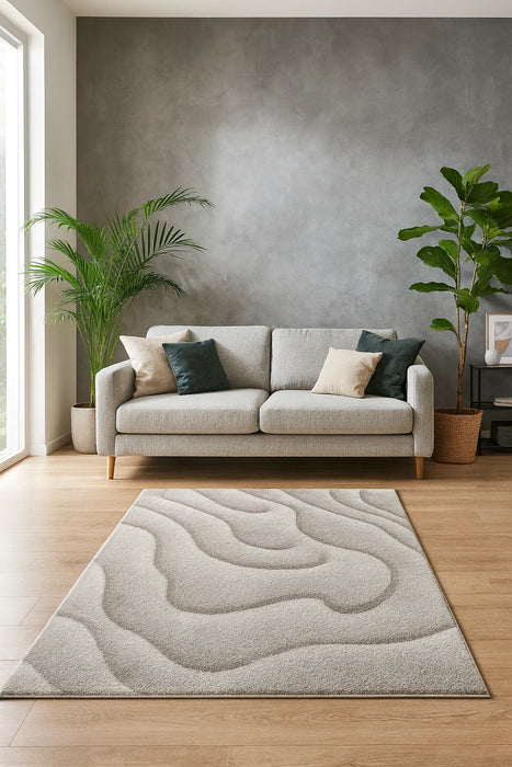 covor crem bej cu model ondulat asezat intr-un living luminos