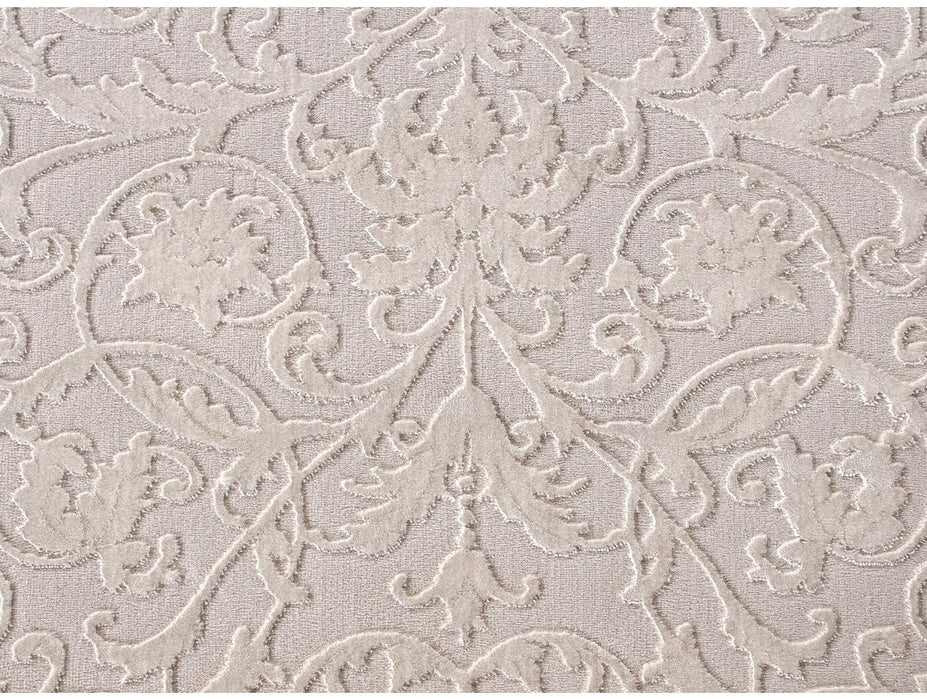 Detaliu textura covor crem cu model fin, material placut la atingere si confortabil