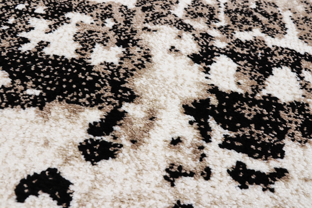 Detaliu covor model abstract crem cu maro si negru stil modern