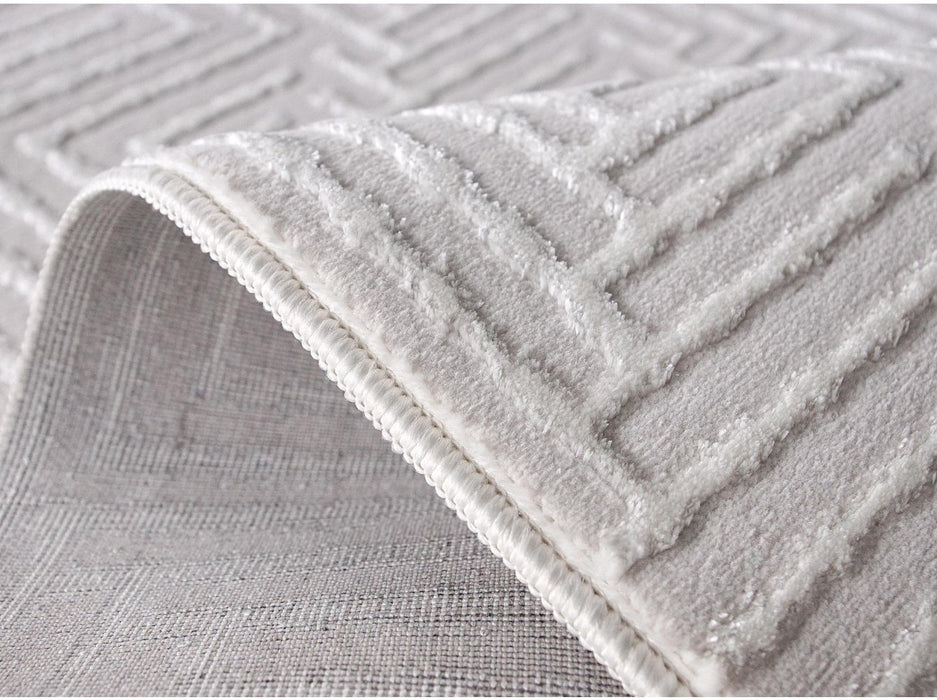 Margine si flexibilitate covor modern alb, material usor de asezat pe parchet