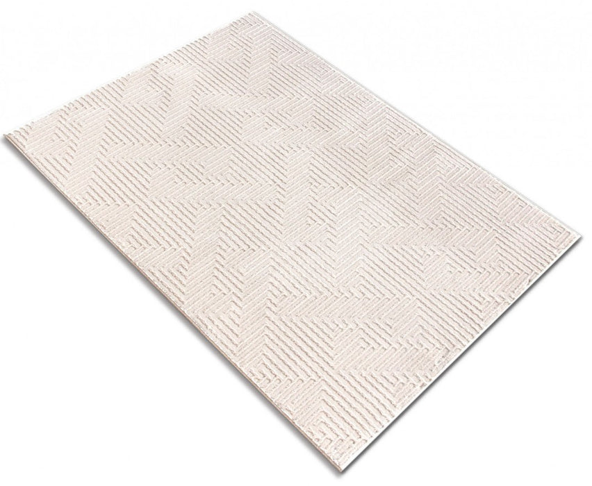 Covor modern crem amplasat in living, culoare deschisa care lumineaza incaperea