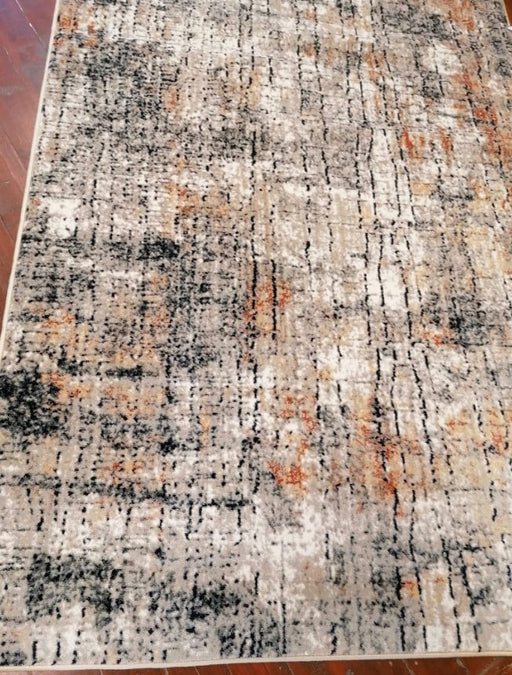 Detaliu textura covor modern gri bej cu accente caramizii design abstract rezistent si usor de intretinut