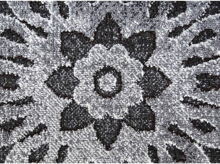 prim plan textura si model abstract gri pe suprafata covorului modern oval