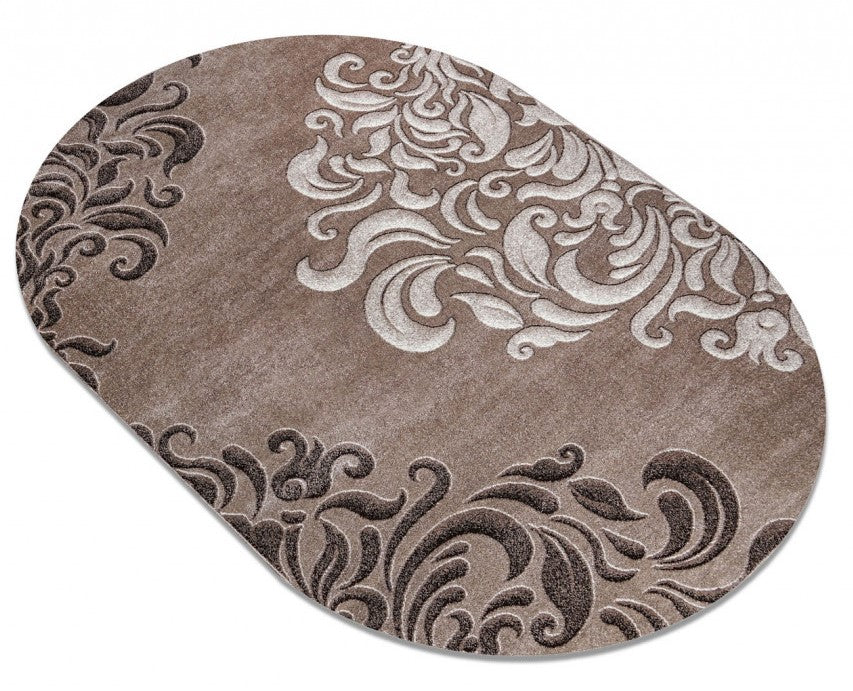 Covor oval bej maro elegant cu model decorativ ornamental potrivit pentru living si dormitor