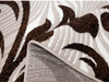 Detaliu textura covor oval modern cu model maro reliefat si fir moale