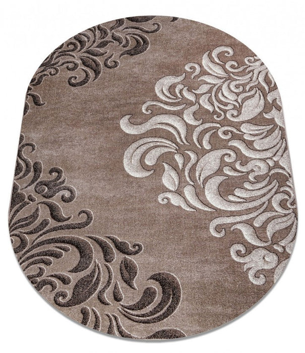 Covor oval modern maro prezentat din unghi lateral evidentiind forma rotunjita si textura moale