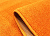 Covor portocaliu gros si rezistent, detalii material premium, covor living confortabil si durabil