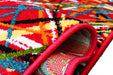 Covor rosu abstract rulat, detalii material moale si rezistent, covor living confortabil si durabil