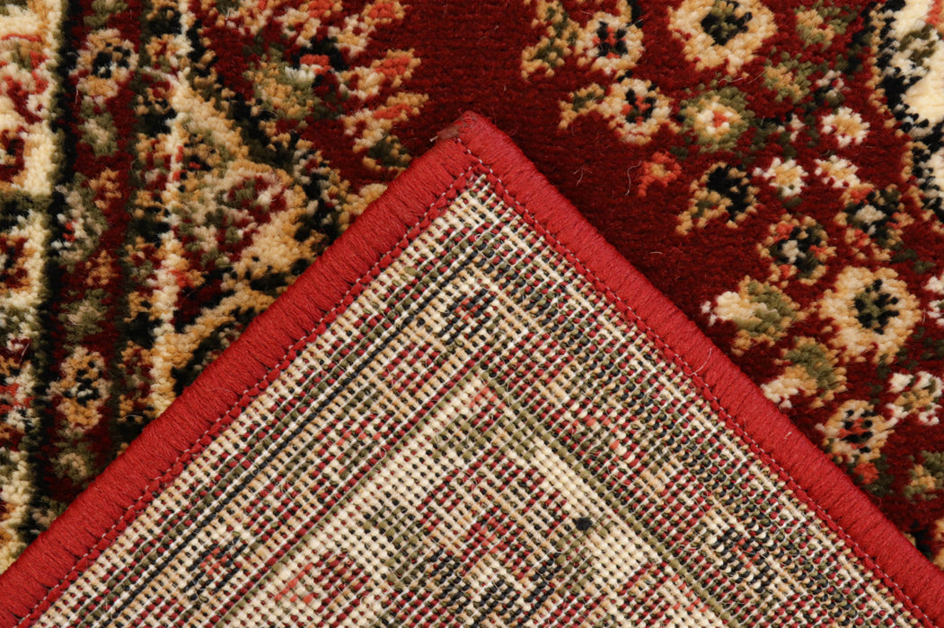 Detaliu colț covor clasic, culoare grena