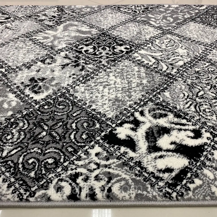 Detaliu model covor gri modern patchwork cu design elegant