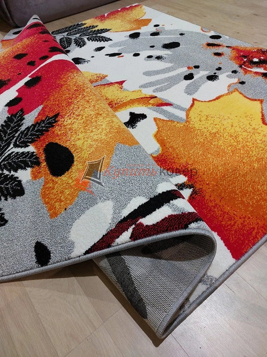 Detaliu covor modern floral pentru living cu textură moale și finisaj premium