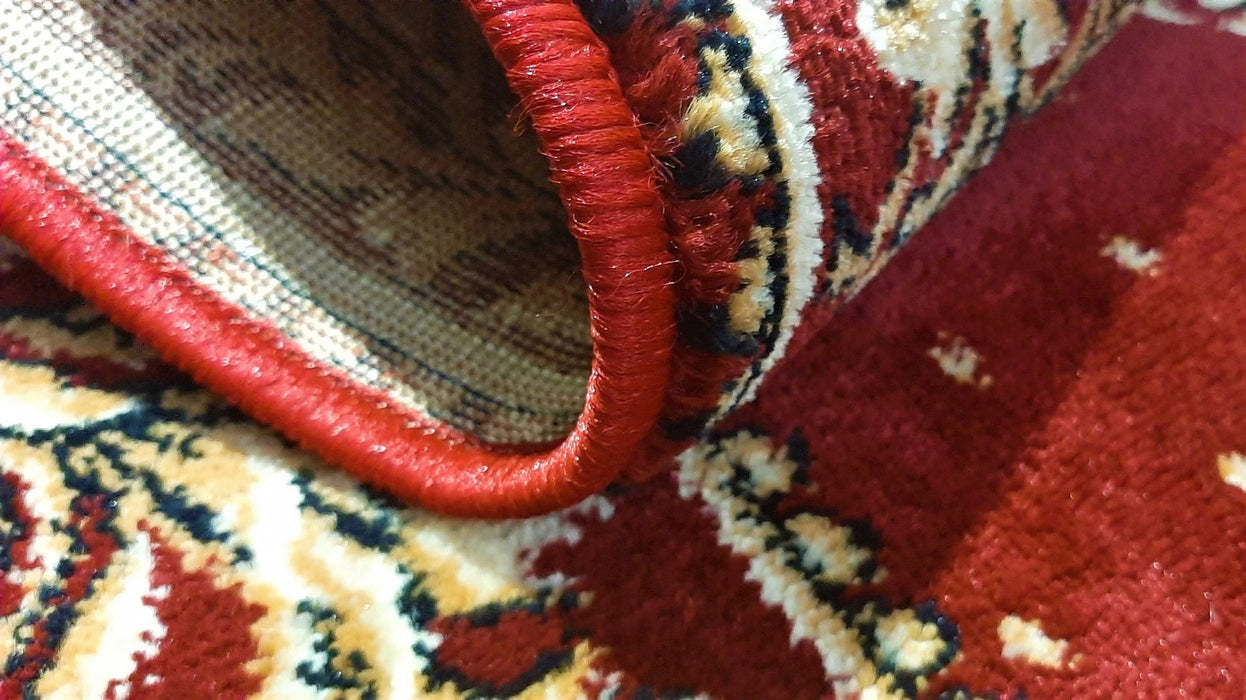 Detaliu margine covor bisericesc oval grena cu vultur bicefal