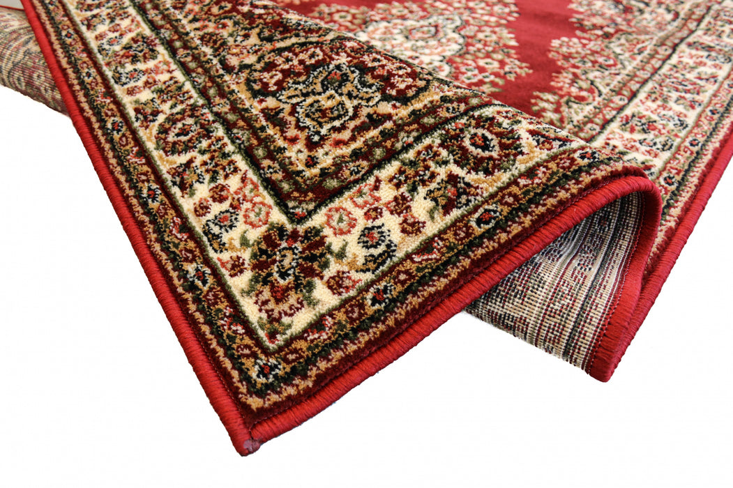 Detaliu margine și finisaj covor clasic grena