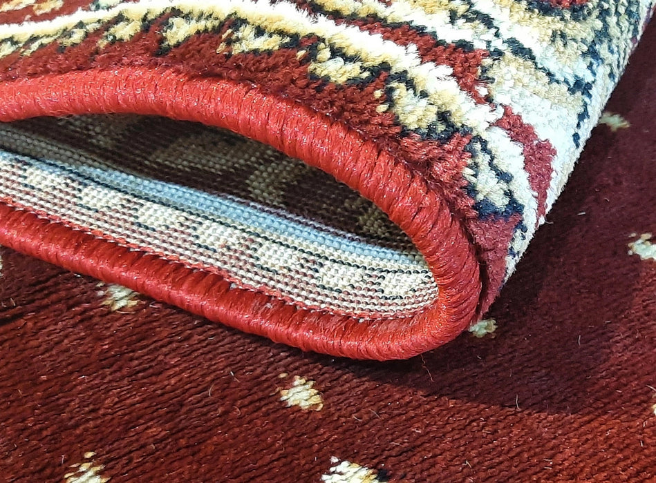 Detaliu material covor bisericesc oval grena cu vultur bicefal