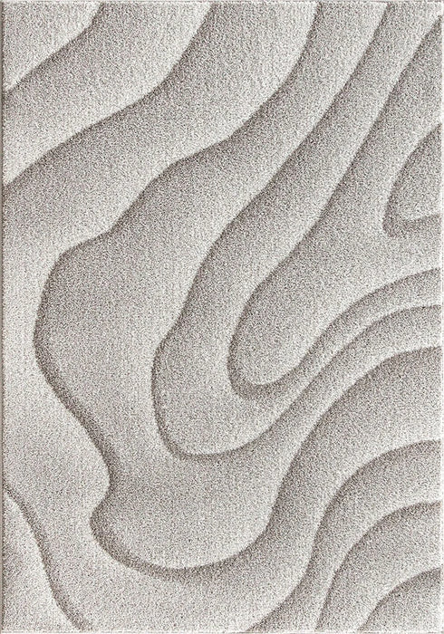 detaliu model ondulat pe covor crem bej