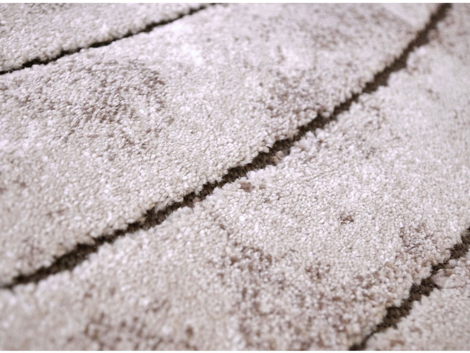 Detaliu textură și model abstract pe covor modern bej maro