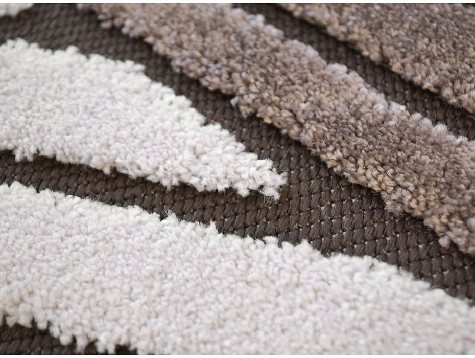Detaliu textură covor modern geometric crem maro