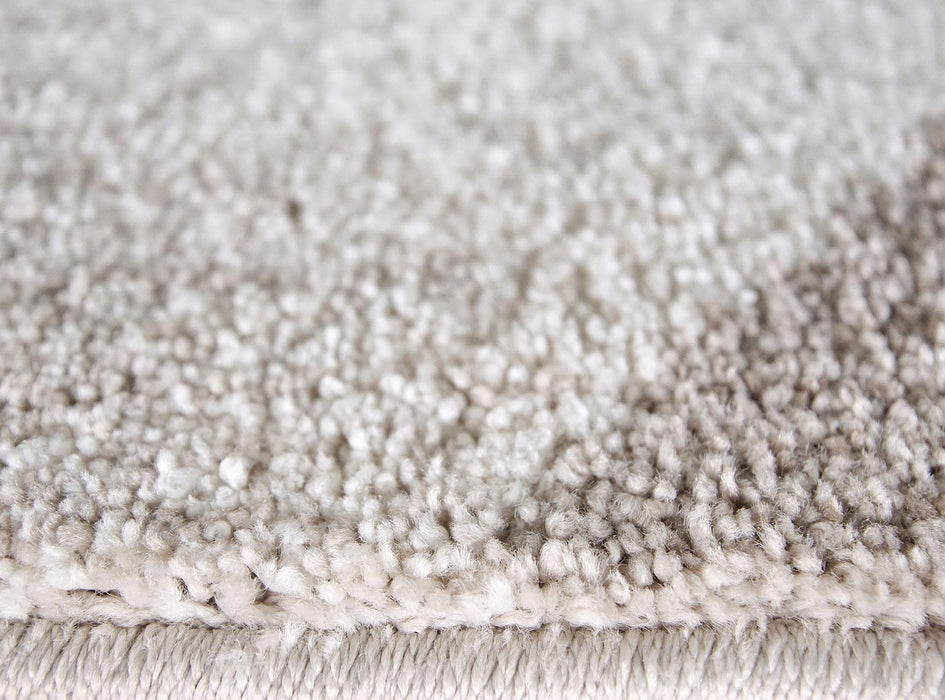 detaliu textura si fir moale pe covor crem bej geometric