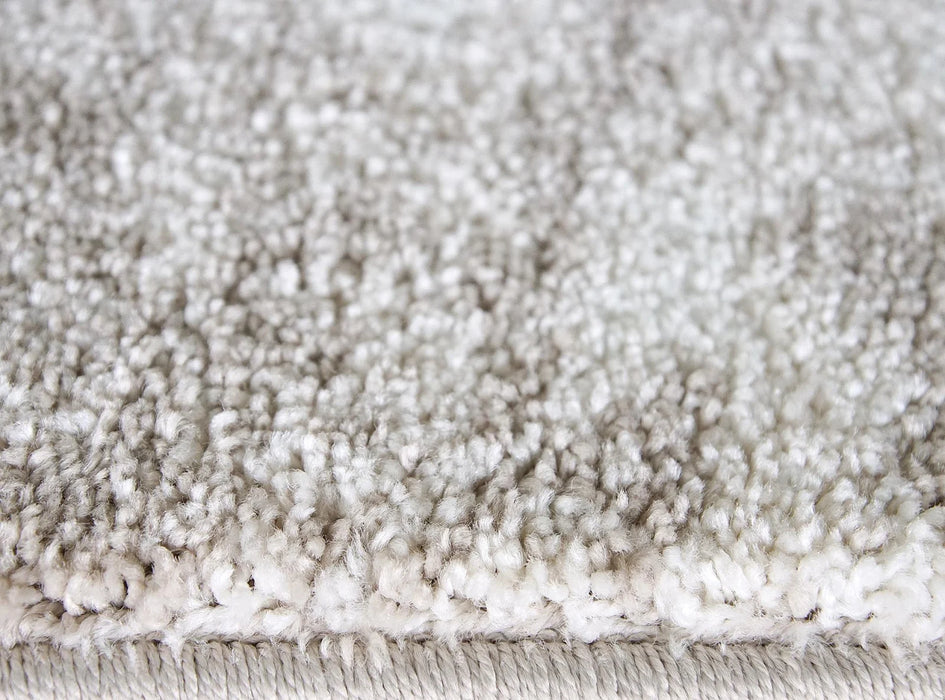 detaliu textura si fir moale pe covor crem bej