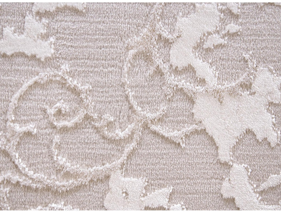 Detaliu textura reliefata cu model abstract crem, covor modern premium cu finisaj delicat