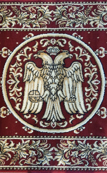 Detaliu vultur bicefal pe covor bisericesc oval, culoare grena