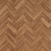 Detaliu linoleum maro model herringbone cu textura lemn natural
