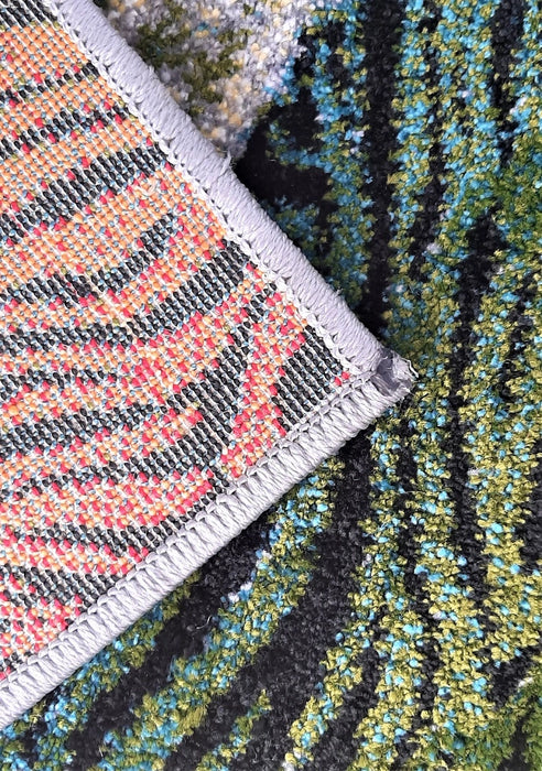 Margine festonata a unui covor living modern cu finisaje elegante si durabilitate crescuta.