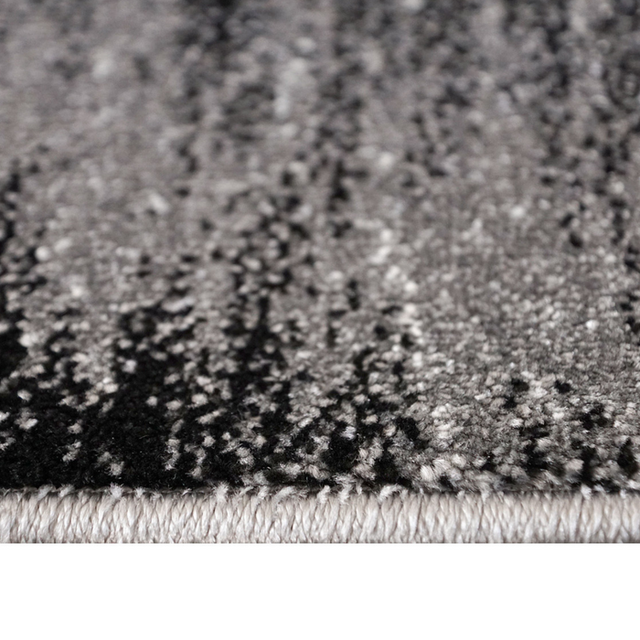 Detaliu textura covor living modern cu fibre dense si finisaje de calitate.