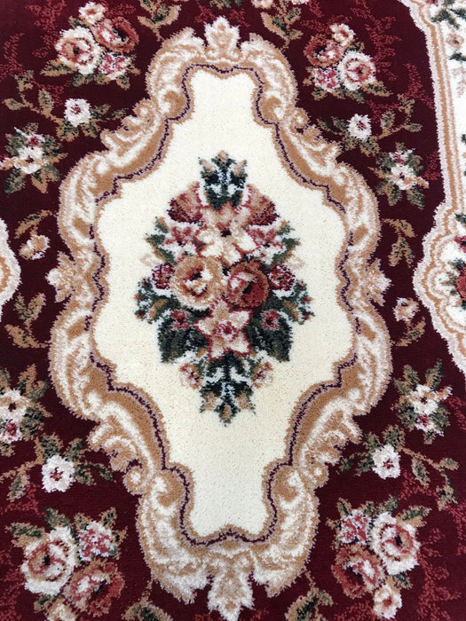 Detaliu model floral central pe traversa covor clasica grena stil oriental